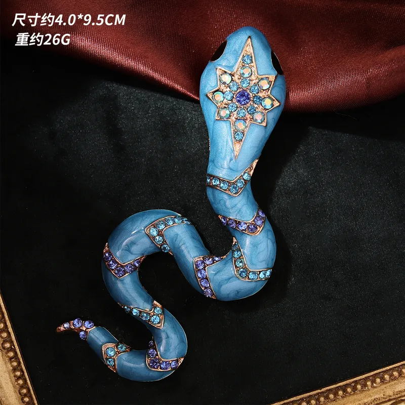 Pin de serpiente azul con dorado