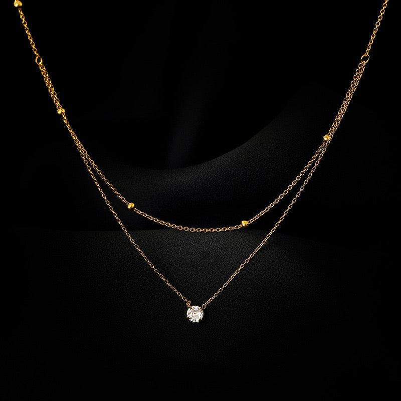 Collar dorado doble cristal acero de titanio 24 cm