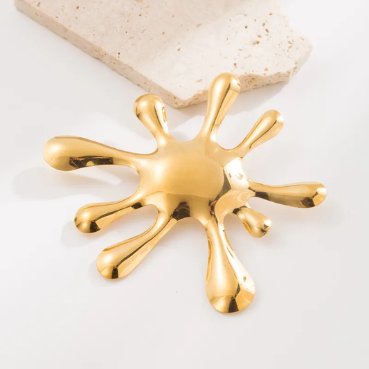 Broche acero inoxidable forma mancha