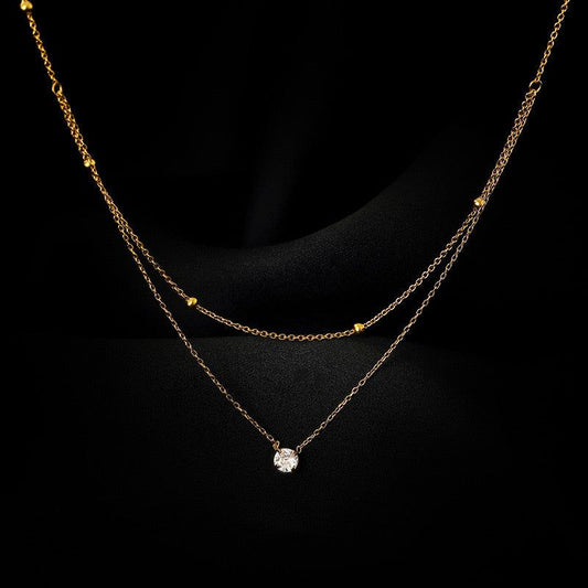 Collar dorado doble cristal acero de titanio 24 cm